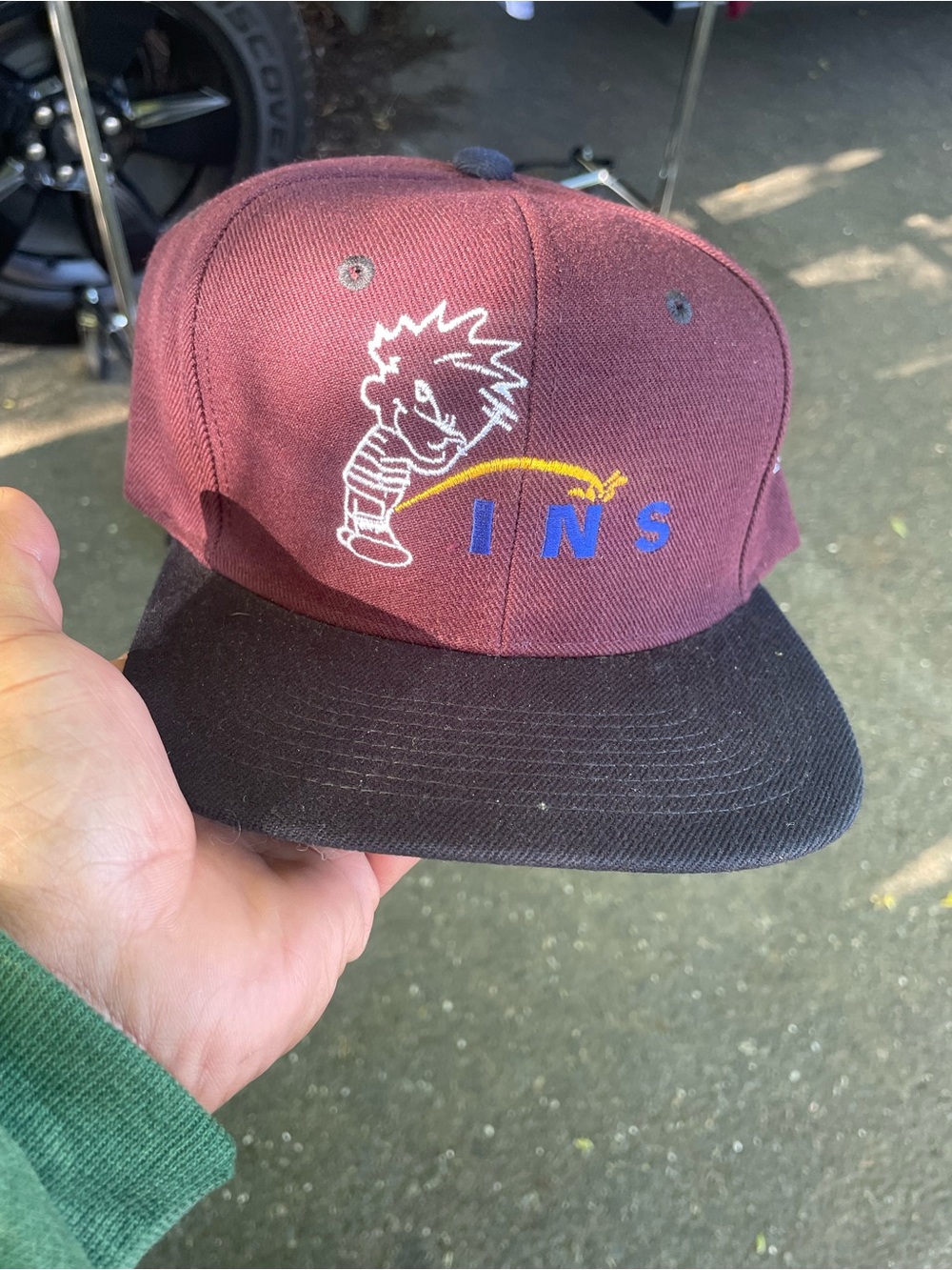Maroon and Black Snapback Hat with Embroidered Cartoon Logo